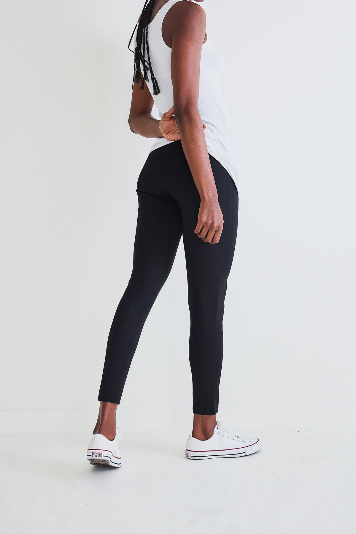 Black ankle-length smart leggings with smooth waistband and fitted leg seams