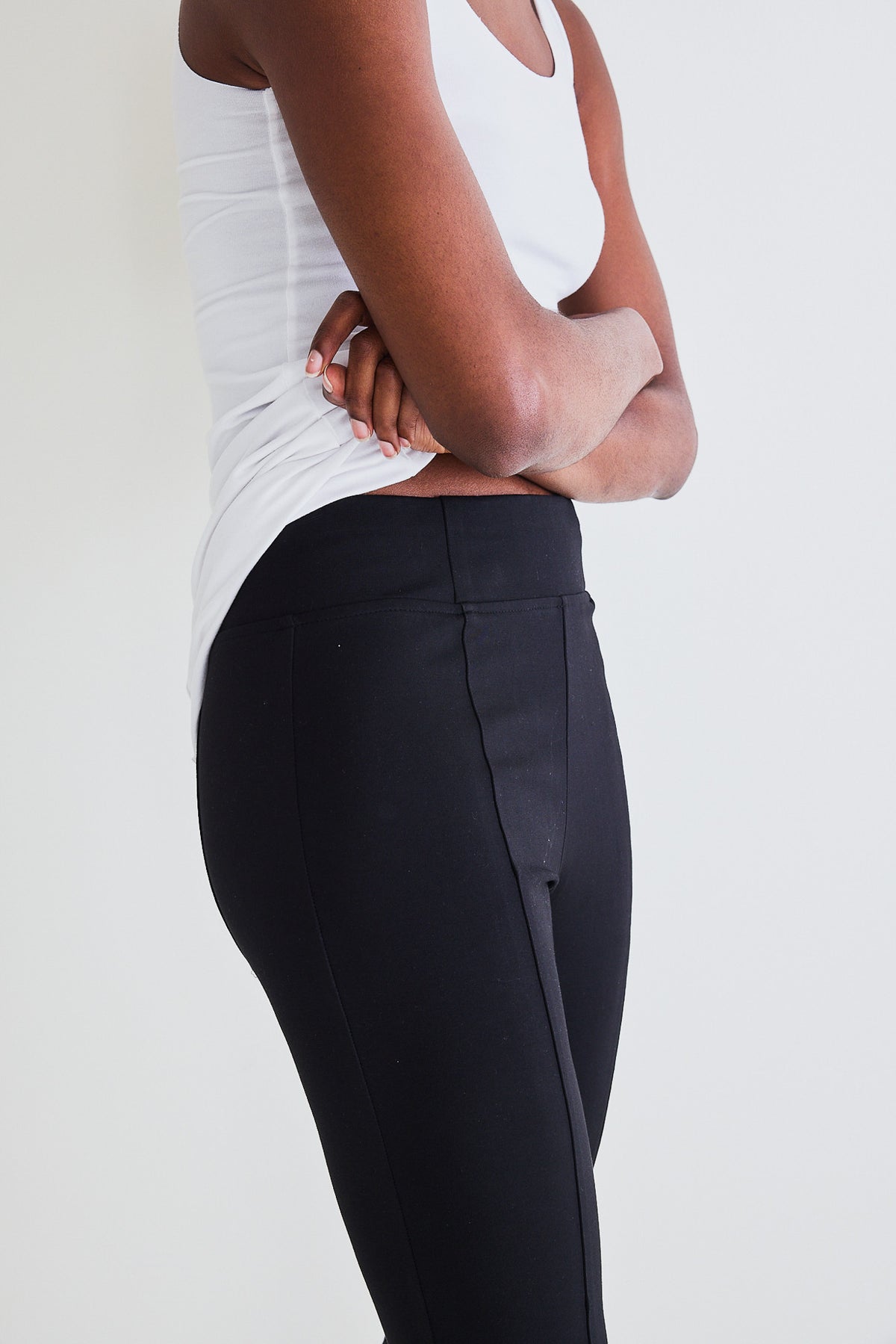 Black smart leggings with contoured side seams and elasticized waistband