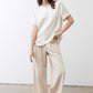 Oatmeal linen wide-leg trousers with loose fit, drawstring waist, and wide straight legs