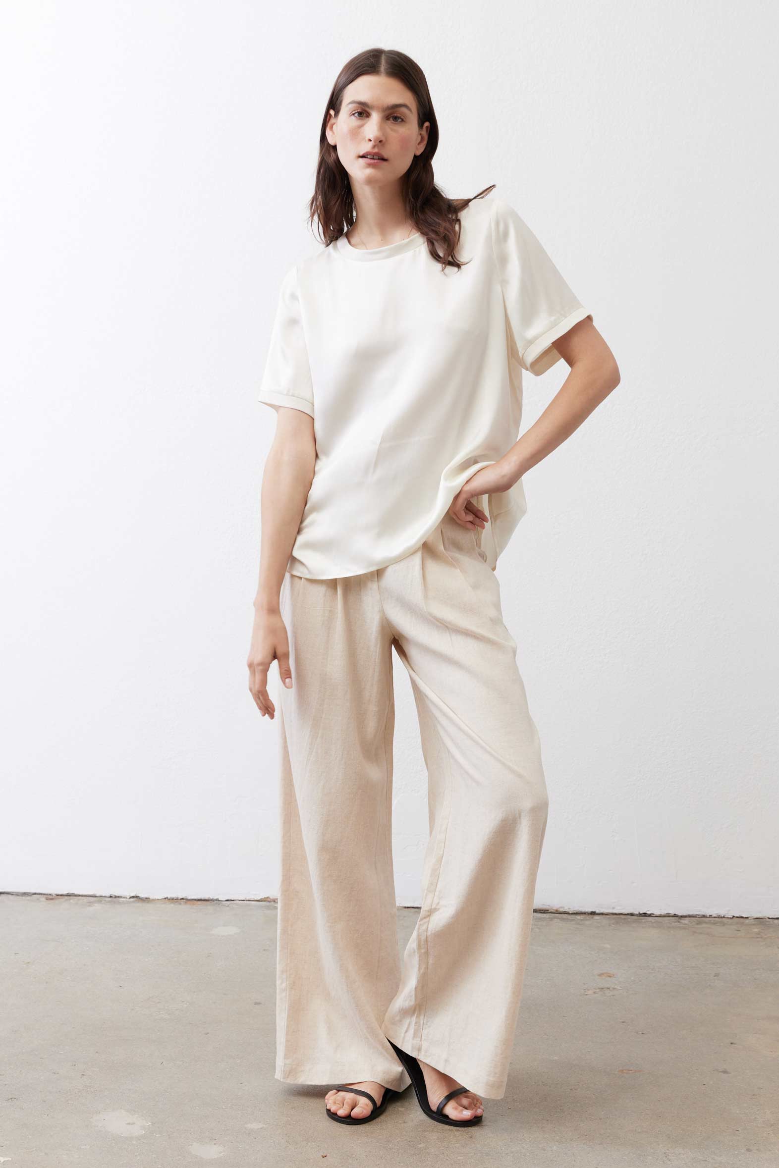 Oatmeal linen wide-leg trousers with loose fit, drawstring waist, and wide straight legs