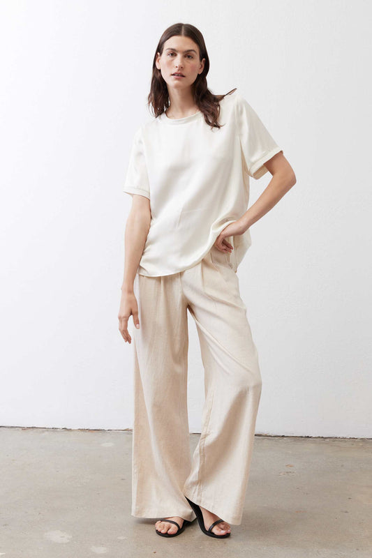 Oatmeal linen wide-leg trousers with elastic waistband and ankle-length wide legs