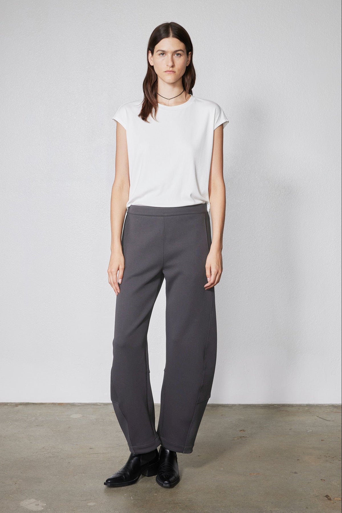 Storm gray work scuba pants on model, straight wide legs with pull-on waistband