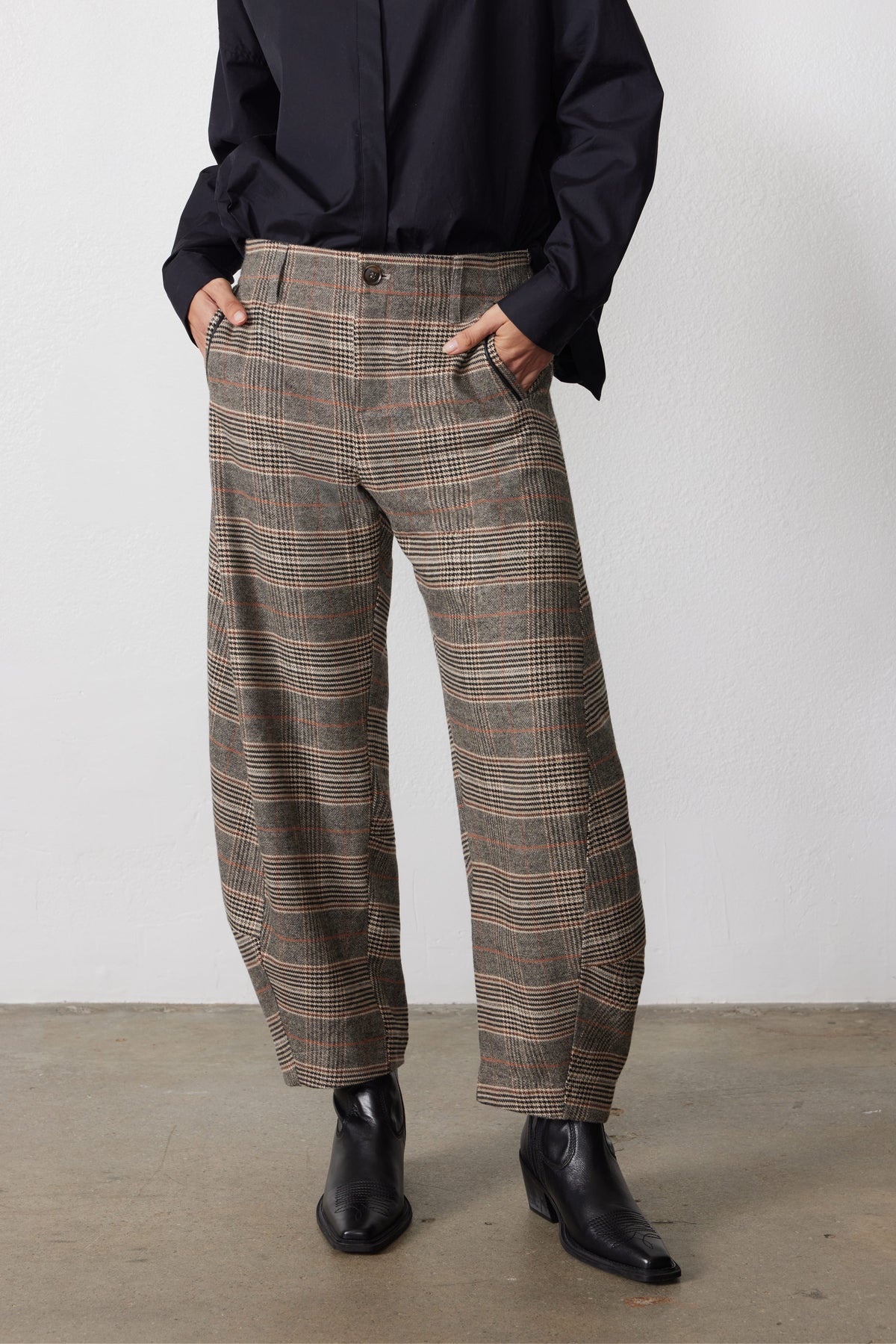 Brown plaid loose barrel pants with high waist, belt loops, and front button closure