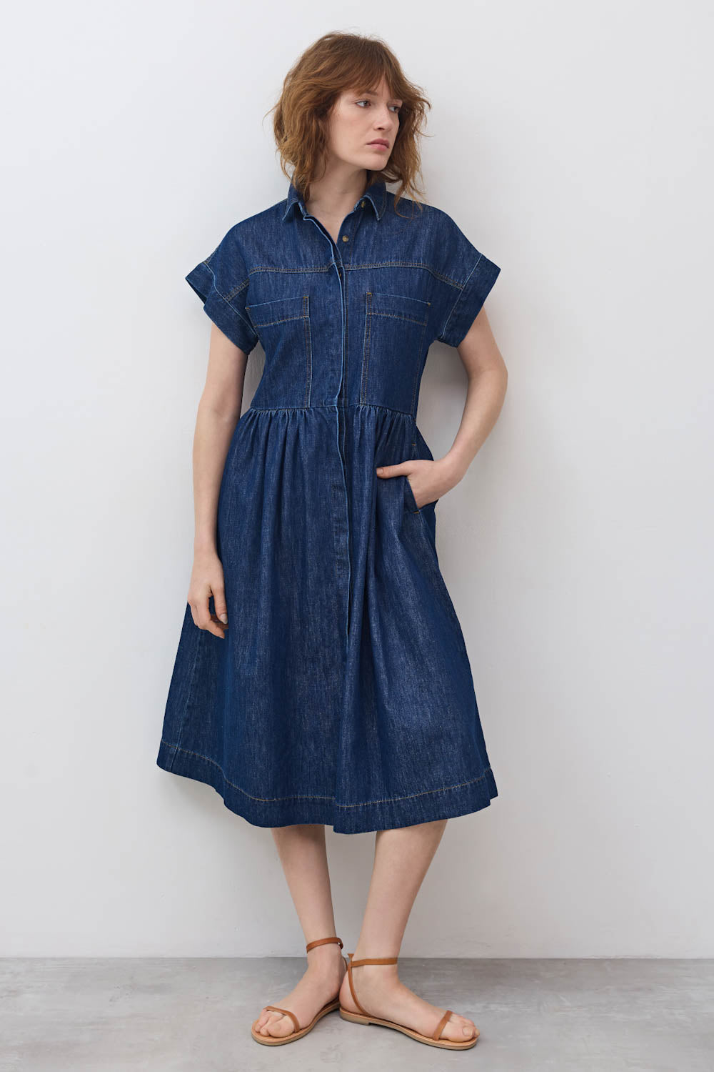 Medium-wash denim shirt dress with short sleeves, button front, gathered skirt