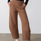 Mocha work scuba pants with elastic waist, side pockets, relaxed ankle-length silhouette
