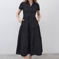 Black long poplin dress with V-neck, short sleeves, tiered skirt and buttons
