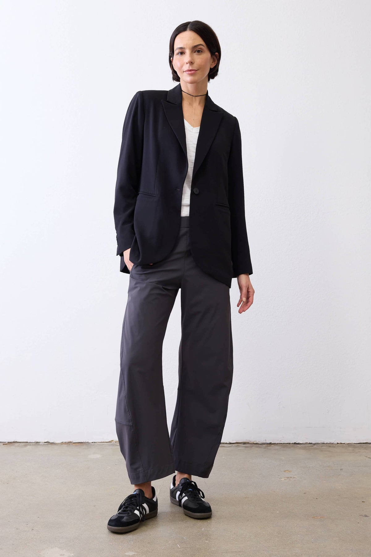 Graphite work pants with elastic waist, wide legs, and ankle-length hem
