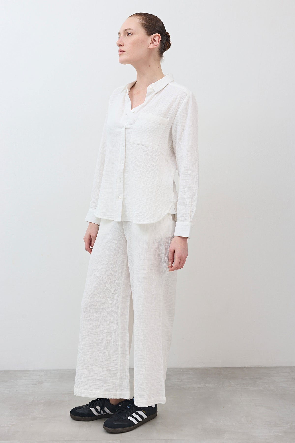 Marshmallow wide-leg pants in textured woven fabric, side view with straight drape
