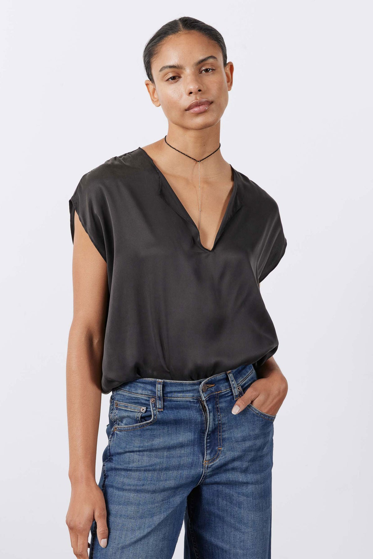 Black washable silk top with V-neck and short sleeves, front view drape