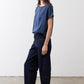 Deep blue silk blouse with short sleeves and crew neck, side view
