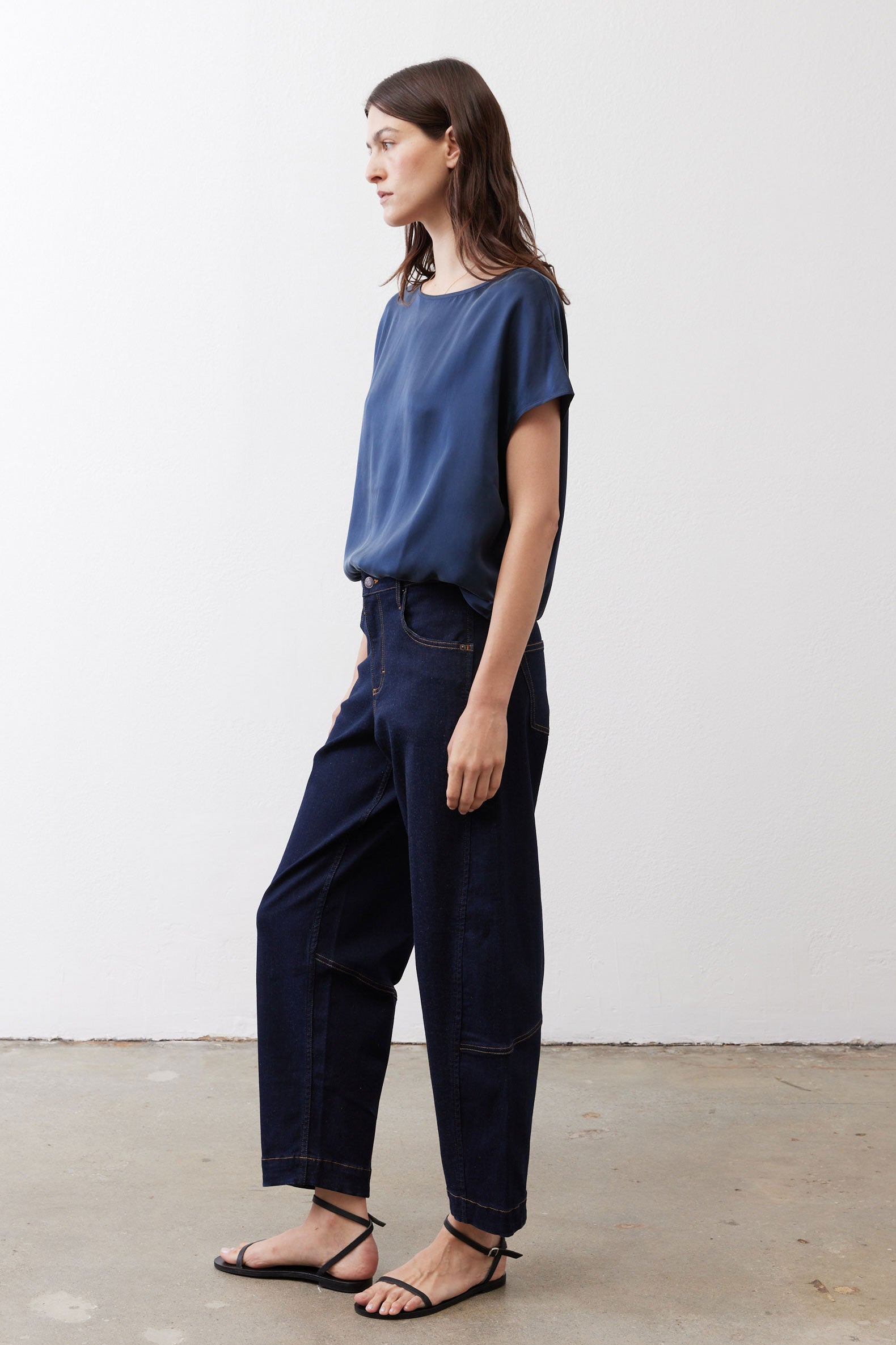 Deep blue silk blouse with short sleeves and crew neck, side view