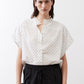 White blouse with small black dot print, button-front and short dolman sleeves