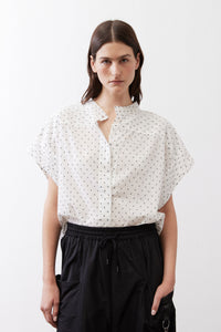 White blouse with black dot print, short sleeves, V-neck button placket