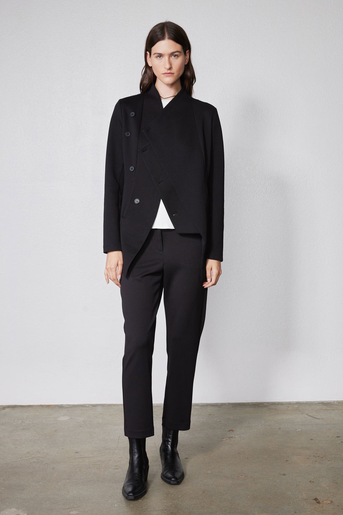 Black asymmetric scuba jacket with stand collar and diagonal wrap front