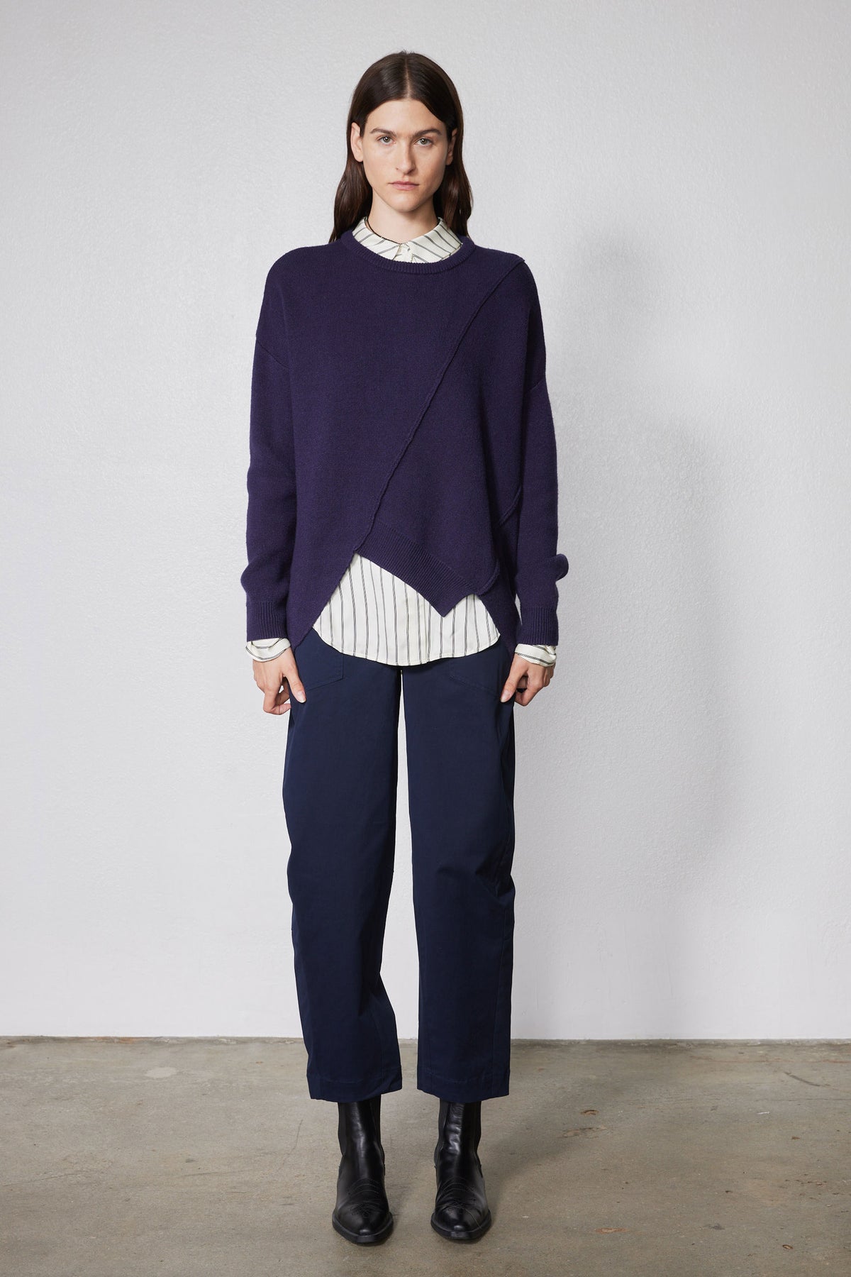 Asymmetric pullover sweater in deep purple, diagonal front seam and ribbed hem