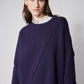 Asymmetric pullover sweater in deep purple, front view with wide cuffs and diagonal drape