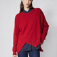 Red asymmetric pullover sweater with diagonal front seam and ribbed crew neck
