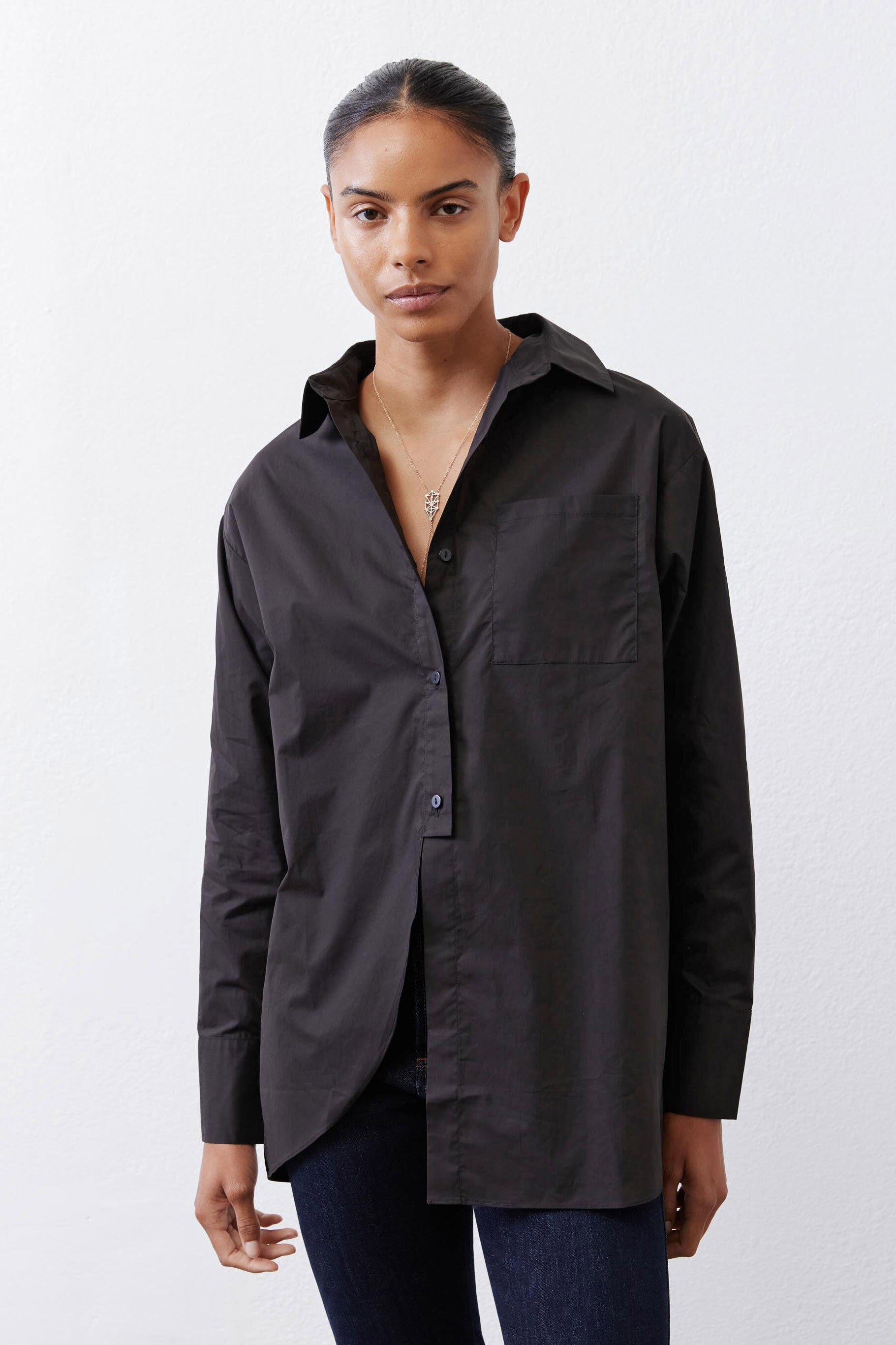 Black asymmetric button-down shirt with chest pocket and front button closure