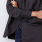 Black asymmetric button-down shirt front placket and curved hem detail