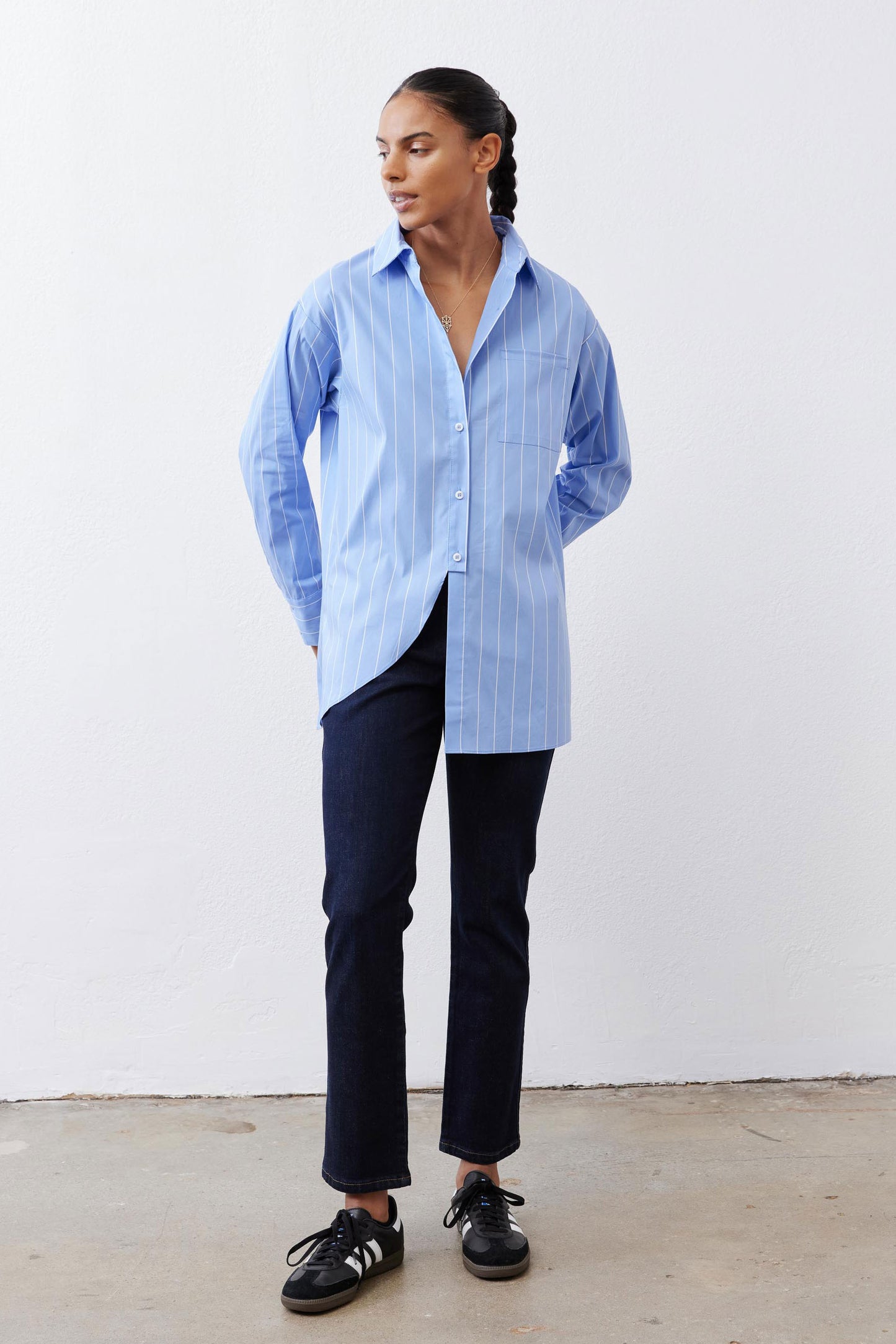 Asymmetric button-down shirt in light blue and white vertical stripe