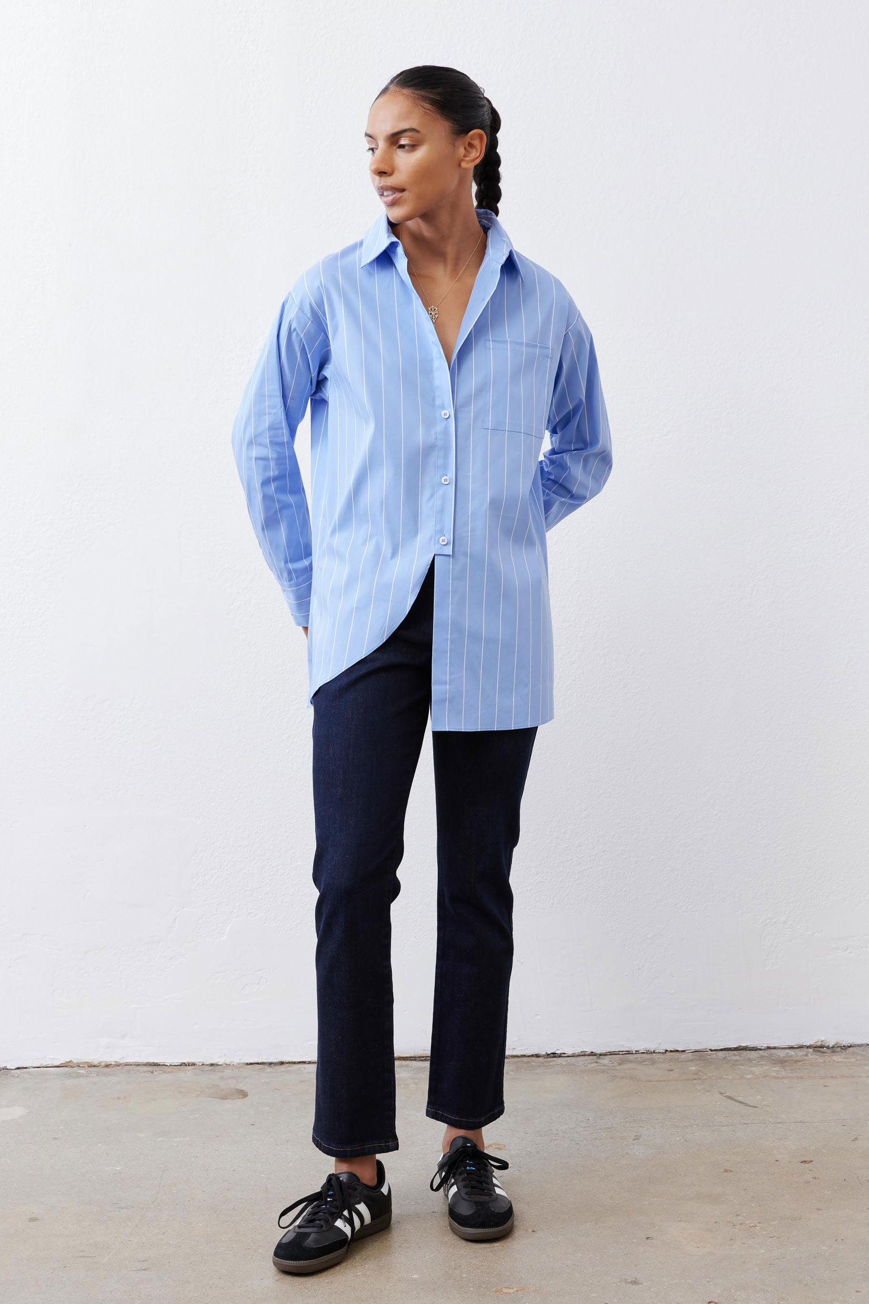 Asymmetric button-down shirt in light blue and white vertical stripe