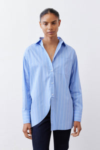 Front view of light blue striped button-down shirt with pointed collar