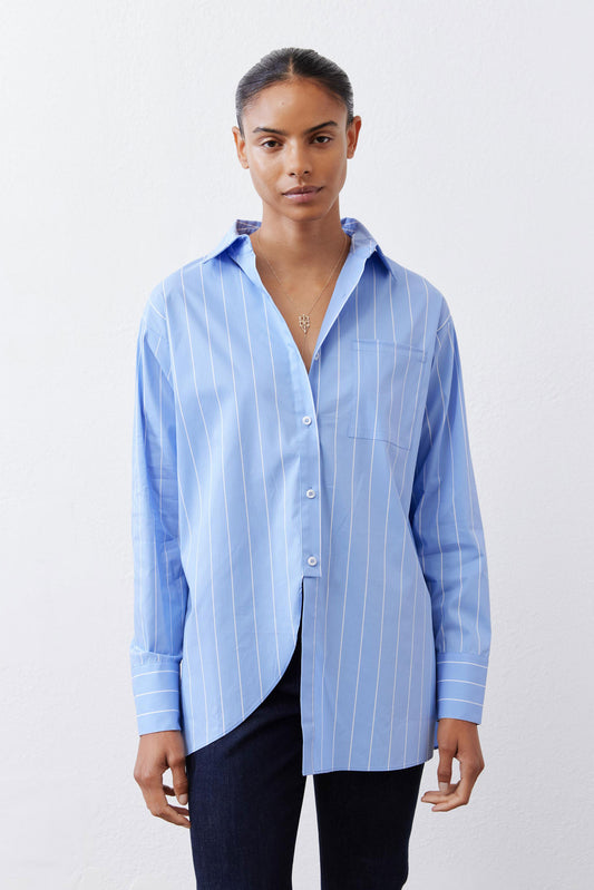 Front view of light blue striped button-down shirt with pointed collar