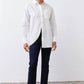 White asymmetric button-down shirt with pointed collar, long sleeves, front split