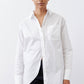 White asymmetric button-down shirt with pointed collar, long sleeves, chest pocket