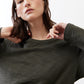 Asymmetric long-sleeve tunic in dark forest green with crew neckline and knit texture