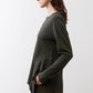Asymmetric long-sleeve tunic in dark forest green with side split and curved hem