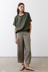 Petite olive-green wide-leg ankle pants with loose silhouette and cuffed ankles