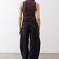 Black baggy utility pants shown from the back with wide cropped legs and elastic waist
