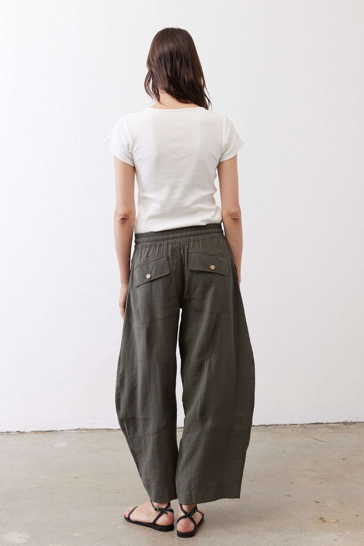 Wide-leg pants, dark olive, elastic drawstring waist and side pockets, back view
