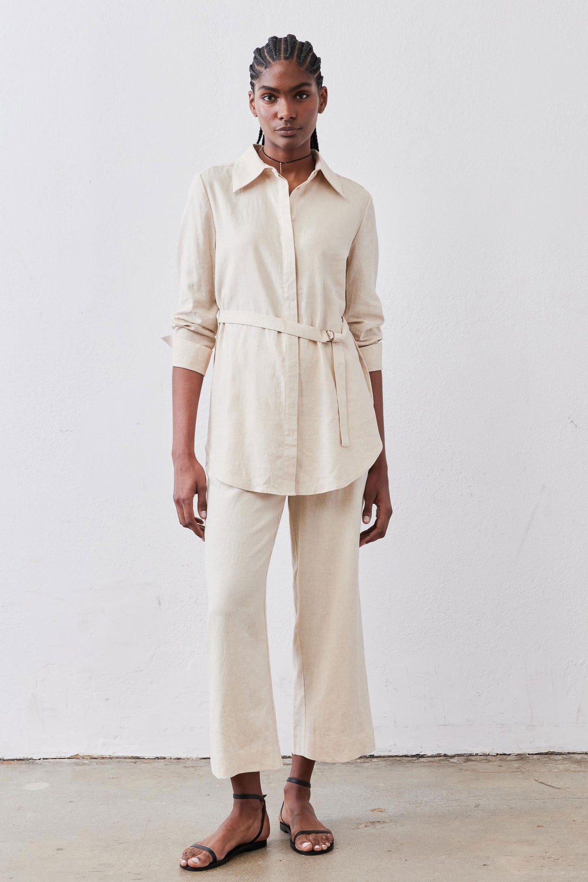 Oat linen A-line pants with high-rise waist, belt loops, and wide ankle-length legs.