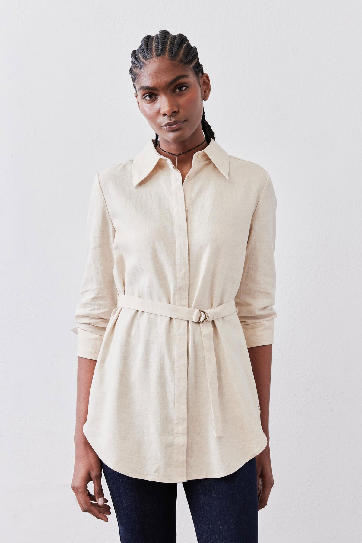 Oat linen belted tunic with pointed collar, button-front, and tied waist belt.