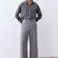 Belted wide-leg trousers in pebble melange gray with metal buckle, straight wide legs