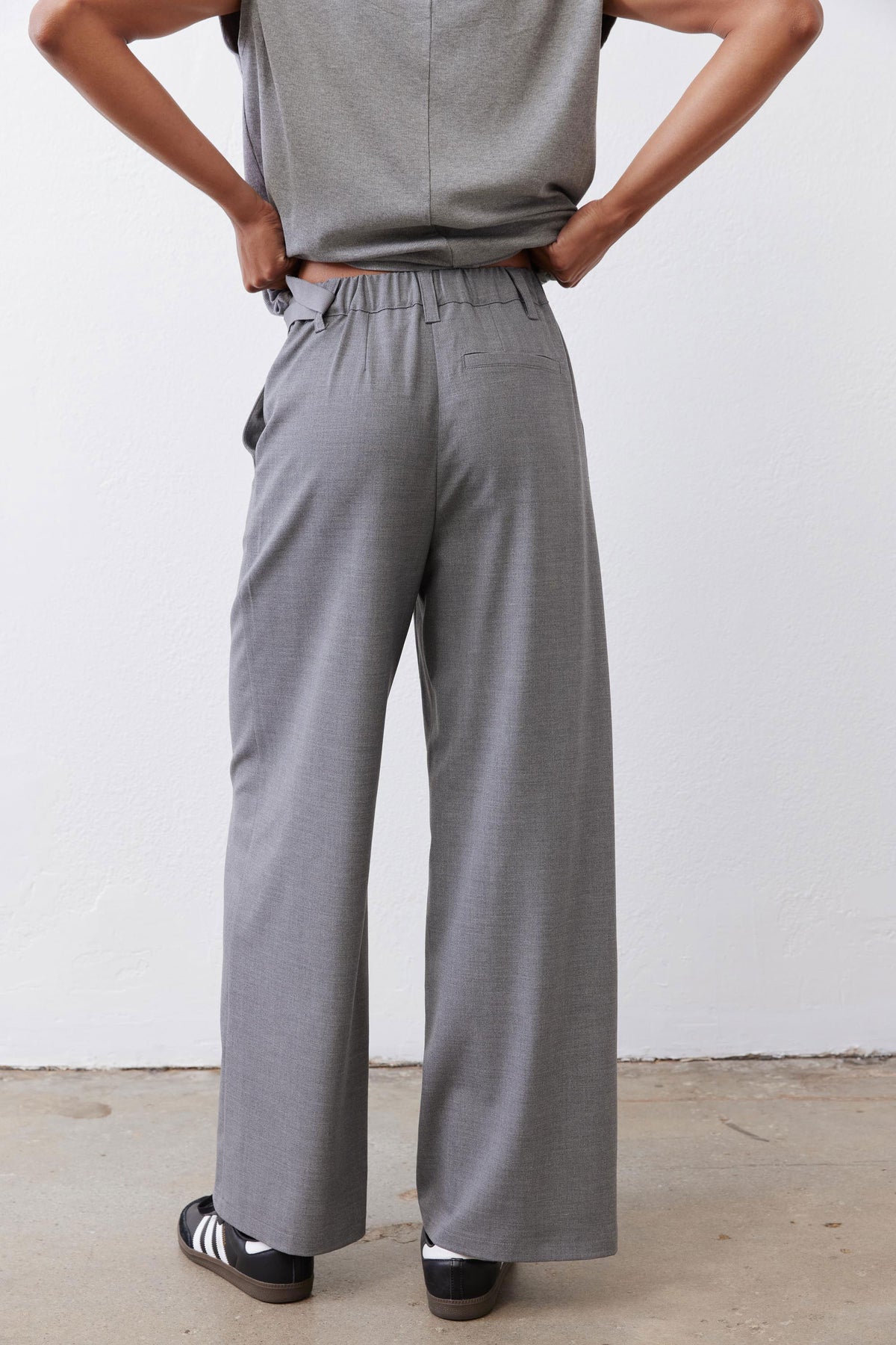 Pebble melange gray wide-leg trousers with belted waist and relaxed drape