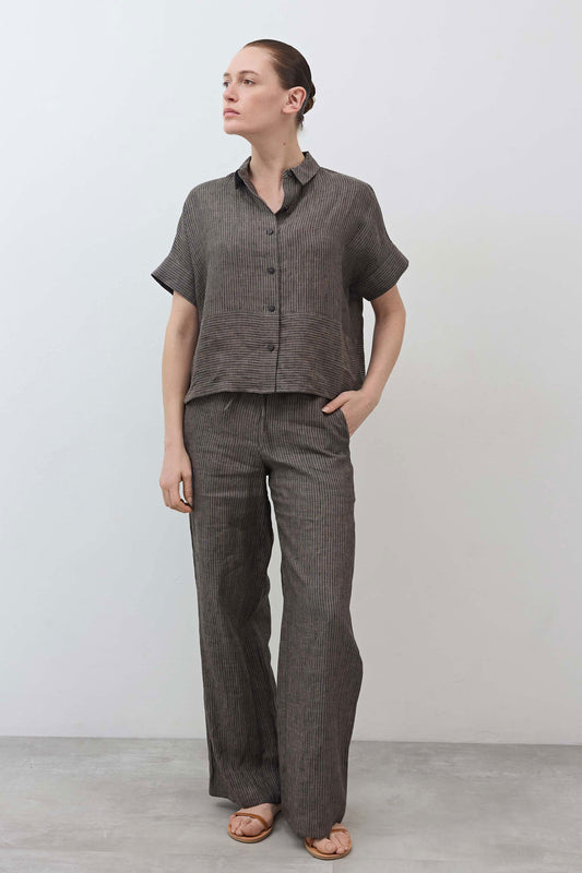 Cropped linen blouse side view: charcoal tan-striped fabric, short sleeves and button front
