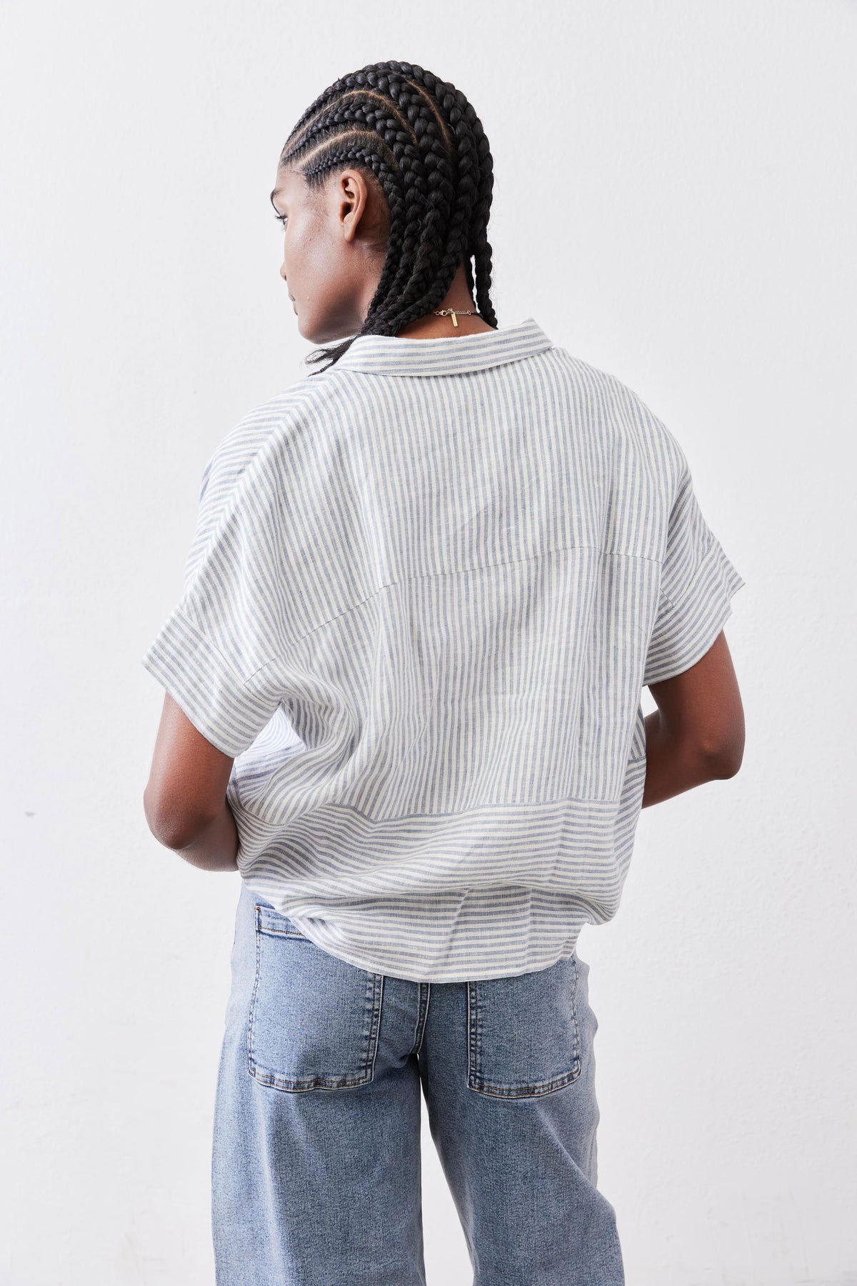 Boxy cropped linen blouse, back view, blue striped fabric, short sleeves