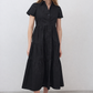 Black long poplin dress with V-neck, short sleeves, tiered skirt and center buttons