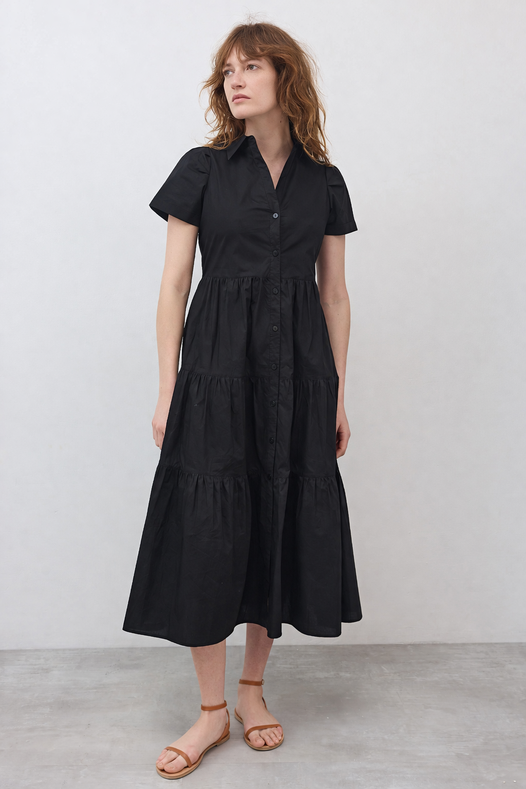 Black long poplin dress with V-neck, short sleeves, tiered skirt and center buttons