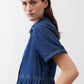 Medium-wash denim midi dress with short sleeves and tiered waist seam