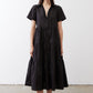 Black long poplin dress with short sleeves, V-neck, and tiered silhouette