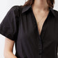 Black button-front dress bodice with V-neck and short sleeves, gathered waist