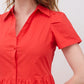Hot coral poplin dress close-up: V-neck button placket and short sleeves
