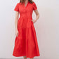 Hot coral long poplin dress with short sleeves, V-neck buttons, and tiered ruffle skirt