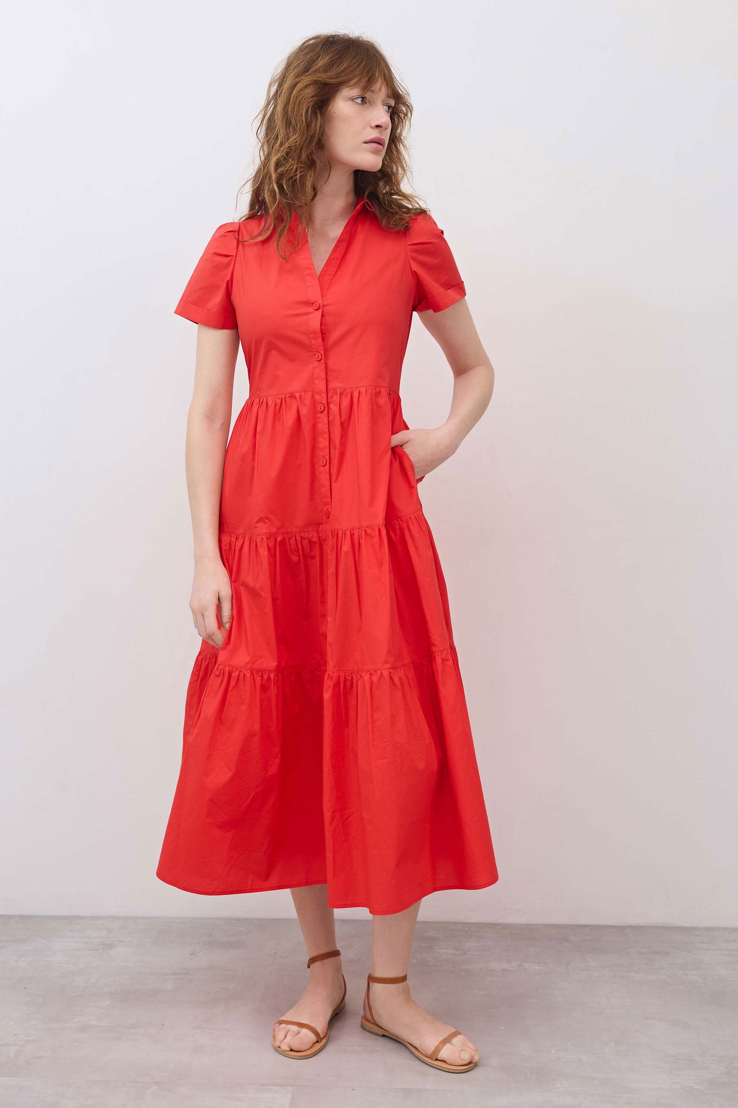 Hot coral long poplin dress with short sleeves, V-neck buttons, and tiered ruffle skirt