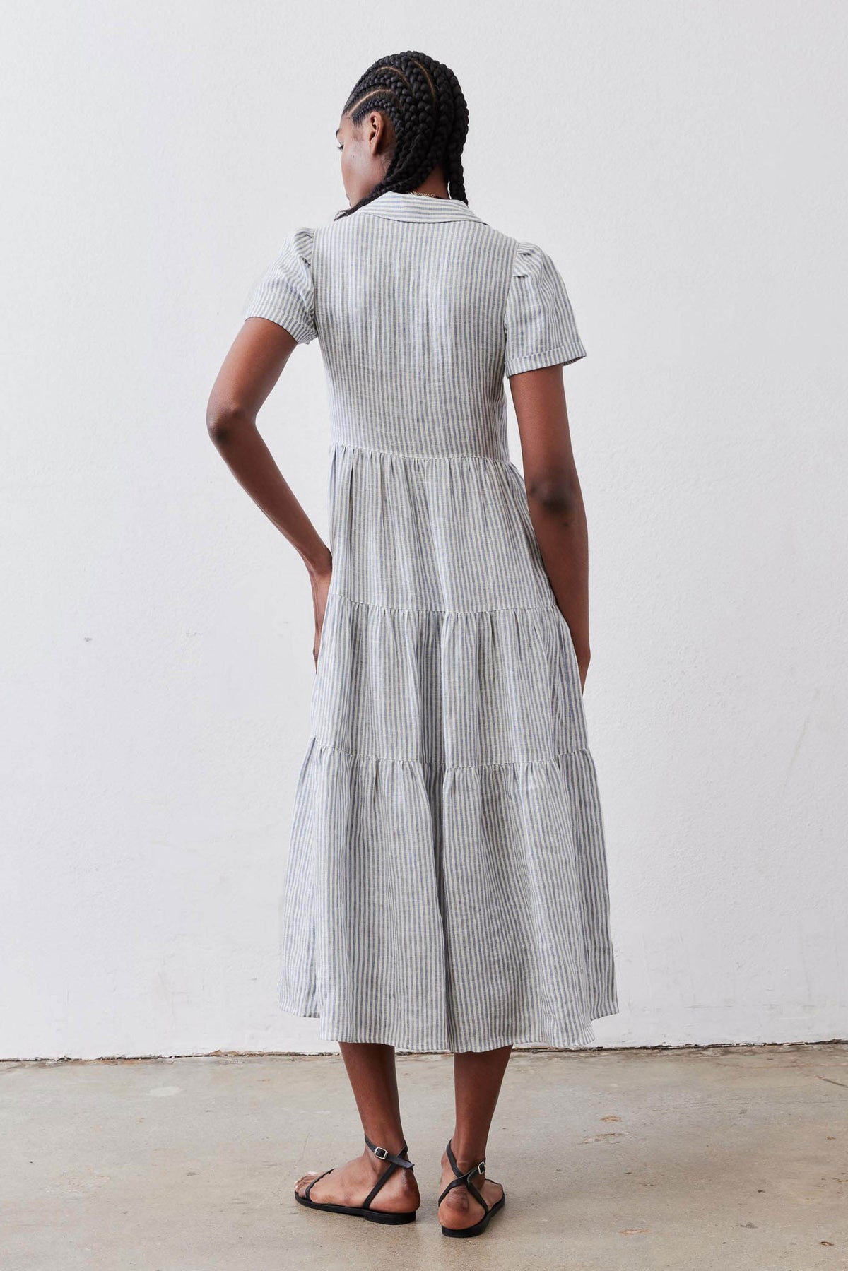 Rear view long white-and-blue striped linen dress, short sleeves, tiered mid-calf length
