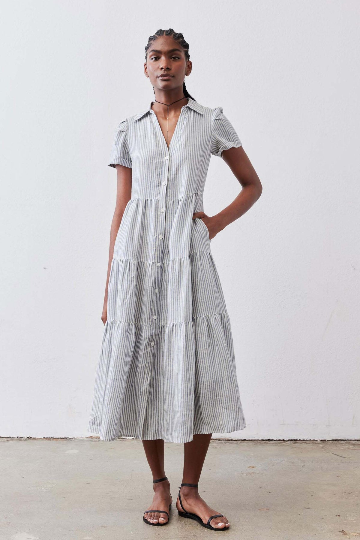 Long button-front linen dress in white with blue stripes, collared short sleeves, tiered tiers
